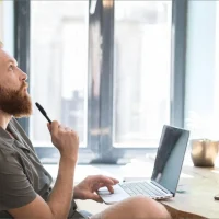side-view-man-thinking-while-working